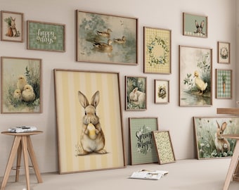May include: A collection of framed art prints with a spring theme. The artwork includes images of ducks, bunnies, chicks, and floral wreaths. The color palette is soft, with pastel tones and a vintage aesthetic. The prints are displayed on a white wall.