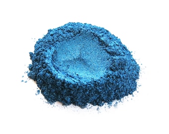 May include: A pile of teal blue mica powder, a type of pigment used in crafts and cosmetics.