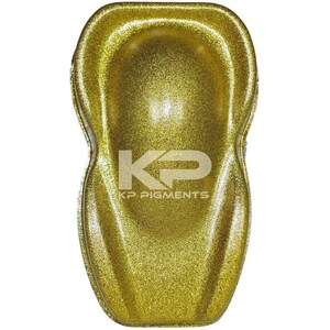 May include: A gold glitter paint sample, showing the texture and sparkle of the paint. The sample is in the shape of a car part, with the logo "KP Pigments" printed on the bottom.