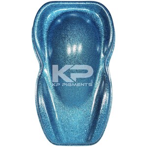 May include: A teal blue glitter paint sample with a white "KP Pigments" logo.