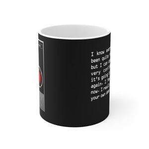 May include: Black coffee mug with a red light and text that reads "I know everything has been quite a shock, but I can assure you, very confident it's going to be alright again. I feel it now. I really do. Your own damn fault."
