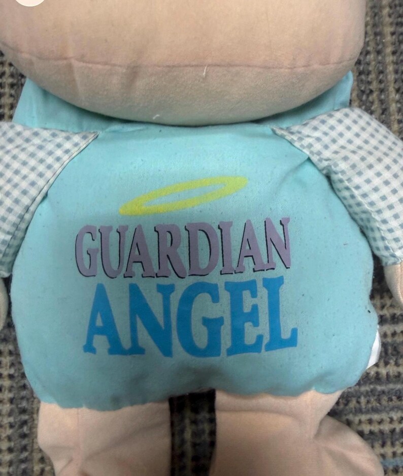 May include: A white ceramic mug with a black handle and the text "But First, Coffee" in a black, bold font. The mug is on a white surface. The mug is approximately 4 inches tall.