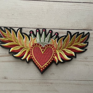 May include: A rustic wooden sign displaying the word "Welcome" in a handwritten font. The sign has a distressed finish, creating a charming, welcoming aesthetic, ideal for a front door or hallway.