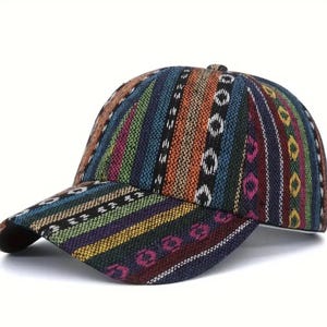 May include: A baseball cap with a colorful, patterned design. The cap features vertical stripes in various colors, including blue, orange, green, and purple, with white and black accents. The brim is curved and the cap has a button on top.