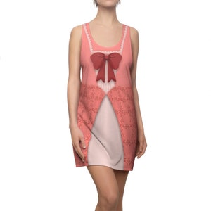 May include: A pink sleeveless dress with a red bow and a white lace trim. The dress has a floral pattern and a fitted silhouette.