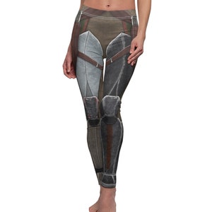 May include: Black and gray leggings with a futuristic design featuring a detailed pattern of armor and straps.