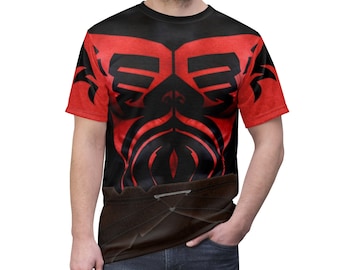 May include: A black t-shirt with a red and black graphic print of a stylized human torso. The graphic print features a tribal design with a red chest and black lines.