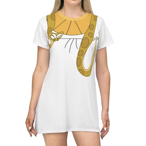 May include: White t-shirt dress with a cartoon snake design in yellow and brown. The snake is wrapped around the neck and chest of the dress.