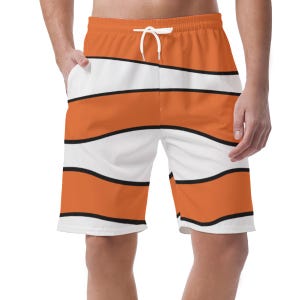 May include: Orange and white striped swim shorts with a black outline. The shorts have a drawstring waistband and pockets. The design is reminiscent of a clownfish. These shorts are perfect for a day at the beach or pool.