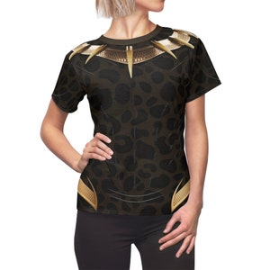May include: Black and gold t-shirt with a leopard print and a gold necklace with spikes.