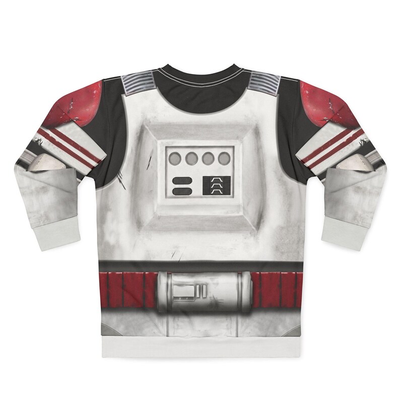 May include: White and black long-sleeved top featuring a graphic design of a space trooper's armour. The design includes red accents on the shoulders and waist, with a detailed chest plate featuring circular and rectangular elements.