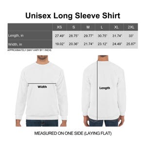 May include: White unisex long sleeve shirt with size chart. The chart shows measurements for length and width in inches for sizes XS to 2XL. The text reads "Unisex Long Sleeve Shirt" and "Measured on one side (laying flat)."