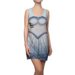 May include: A sleeveless dress featuring a light blue bodice and a white and blue patterned skirt. The dress has a scoop neckline and a decorative blue trim. The design includes a torn section on the bodice, adding a unique visual element. The dress is a costume-themed garment.