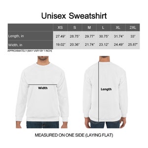 May include: White unisex sweatshirt with size chart. The chart displays length and width measurements in inches for sizes XS to 2XL. The text "Unisex Sweatshirt" is at the top. The image shows how to measure the length and width.