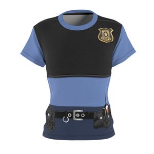May include: A blue and black t-shirt designed to resemble a police uniform. The shirt features a gold-colored badge, a black belt with a silver buckle, and two black pouches. The design includes a light blue short-sleeved shirt.