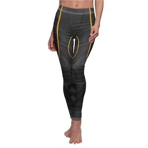 May include: Black leggings with yellow accents and a geometric pattern.