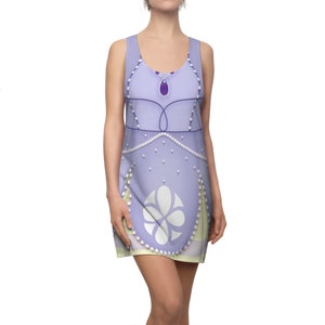 May include: A lavender sleeveless dress with a white floral design and pearl accents. The dress has a scoop neck and a relaxed fit.
