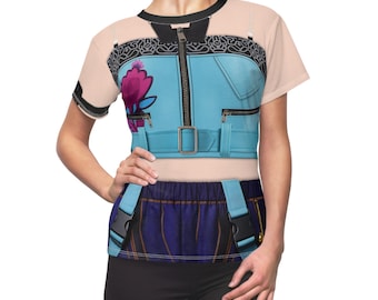 May include: A light blue t-shirt with a printed vest design, including a zipper, belt, and pockets. The vest design incorporates a pink floral element. The shirt has short sleeves and a black collar.