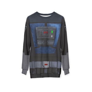 Puede incluir: Sudadera negra de manga larga con un dise&ntilde;o gr&aacute;fico que se asemeja a un disfraz. El dise&ntilde;o presenta una placa pectoral azul con detalles rojos y verdes, un cintur&oacute;n gris y mangas grises. La sudadera es de cuello redondo.