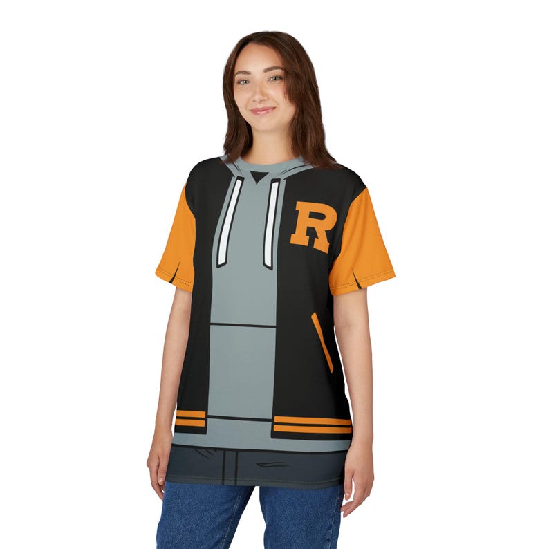 May include: A black and gray t-shirt with a cartoon image of a black and orange varsity jacket with a white hoodie and the letter "R" on the front.