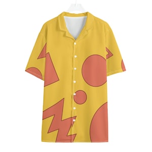 May include: Yellow button-down shirt with a geometric pattern of orange shapes, including circles, triangles, and zigzags. The short-sleeved shirt has a collared neckline and white buttons.