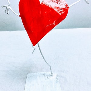 happy heart sculpture painted steel by Beau Smith