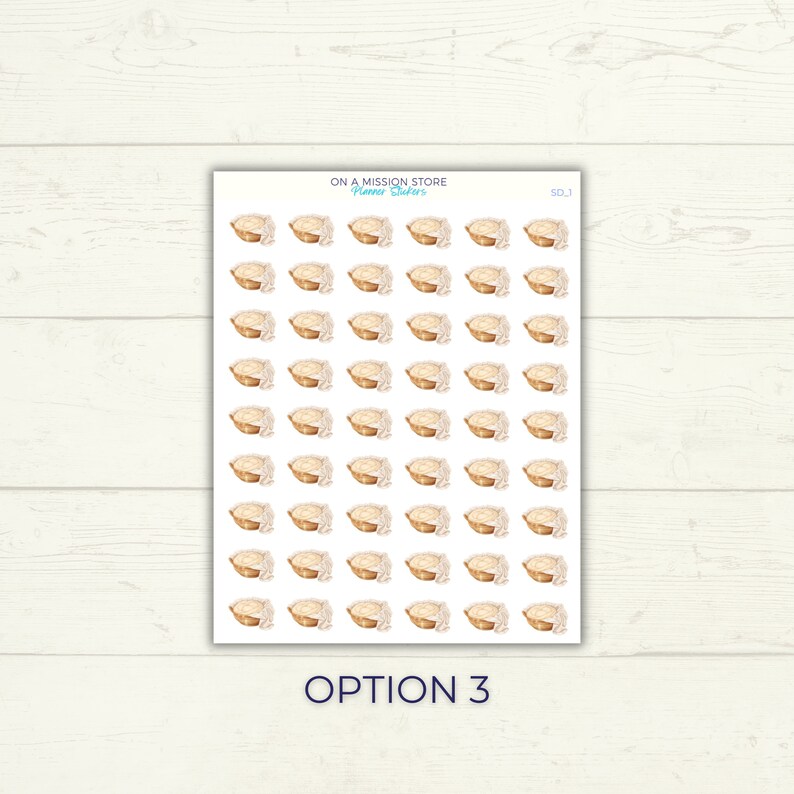 May include: A sheet of 49 stickers featuring a watercolor illustration of a loaf of bread in a basket. The stickers are white with a light brown border. The text "ON A MISSION STORE" and "Planner Stickers" is at the top of the sheet. The text "SDJ" is in the top right corner. The text "OPTION 3" is at the bottom of the sheet.