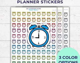 May include: A sheet of planner stickers featuring a blue alarm clock with black hands and numbers. The sheet has 30 stickers in three color options: red, yellow, and green.