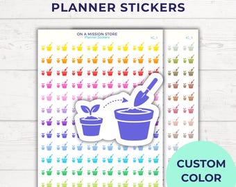 May include: A sheet of small, colorful repotting icon planner stickers featuring a plant in a pot and a trowel. The text reads "REPOTTING ICON PLANNER STICKERS" and "ON A MISSION STORE". A larger, die-cut purple sticker shows a plant being moved into a larger pot.
