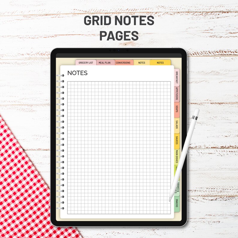 May include: A digital tablet displaying a printable gridded notes page with tabs for grocery list, meal plan, conversions, and notes. The page is divided into sections for different types of recipes, including breakfast, appetizers, soups, salads, sauces, main dishes, side dishes, snacks, and drinks.