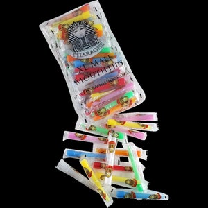May include: A clear plastic bag filled with colorful XL Male Mouthtips. The bag features a logo with a pharaoh's face and the text "Pharaohs." Individual mouthtips are in various colors, including yellow, orange, pink, green, and blue.