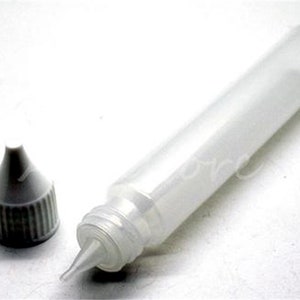 May include: A clear, translucent plastic bottle with a pointed tip and a separate cap. The bottle is cylindrical, and the cap is dark gray with a ribbed texture. The bottle and cap are on a white surface.