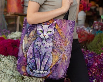 May include: A purple and gold tote bag with a colorful cat illustration. The cat is sitting with its front paws crossed and has green eyes. The background is a swirling pattern of purple, gold, and white.