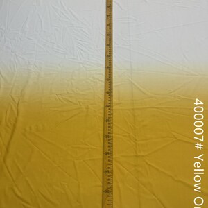 May include: A yellow ombre fabric with a white top. A ruler is placed next to the fabric to show the length. The fabric is labeled "400007# Yellow Ombre".