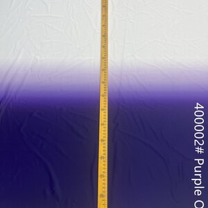 May include: A white to purple ombre fabric with a ruler measuring 60 inches. The fabric is smooth and has a slight sheen. The fabric is labeled 400002# Purple Ombre.