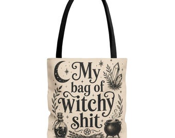 May include: A beige tote bag with black handles featuring the black text My bag of witchy shit. The design includes illustrations of a crescent moon, crystals, a potion bottle, a steaming cauldron, a pentagram, and leafy botanical sprigs.