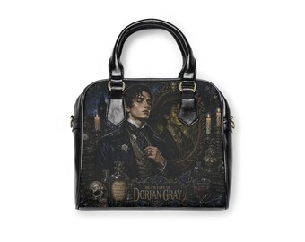 May include: A black handbag featuring a printed illustration of a man in a dark suit, a skull, candles, and a mirror. The text "THE PICTURE OF DORIAN GRAY" is printed at the bottom. The bag has two black handles and gold-toned hardware attachments.