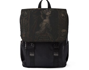 May include: A black backpack featuring a flap with a dark, detailed illustration of Dracula and Mina Harker. The text "DRACULA & MINA HARKER" is printed on the flap, which also displays candles, a skull, and ornate frames. The bag has two buckles.