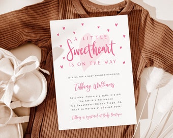 May include: A pink and white baby shower invitation with the text "A Little Sweetheart is on the Way". The invitation includes the date, time, and location of the shower, as well as the name of the guest of honour, Tiffany Williams.