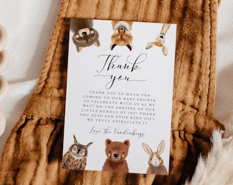 May include: Thank you card with a woodland animal theme. The card has an owl, fox, bear, rabbit, and deer peeking over the top. The text reads "Thank you" in a script font and "Thank you so much for coming to our baby shower to celebrate with us as we wait on the arrival of our little bundle of joy! Thank you also for your kind gift. We truly appreciate it. Love, the Vandenbergs."