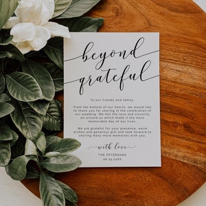 May include: A white card with black calligraphy that reads "beyond grateful". The card has a message thanking guests for attending a wedding and includes the date "06.25.20XX".
