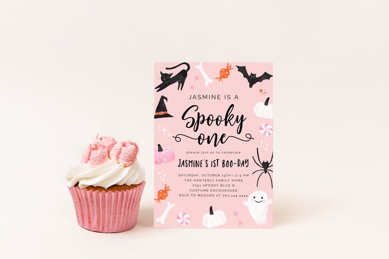 May include: Pink Halloween party invitation with black and white illustrations of a witch's hat, a black cat, a bat, a spider, a ghost, pumpkins, candy, and bones. The text reads "Jasmine is a Spooky one" and "Jasmine's 1st Boo-Day".