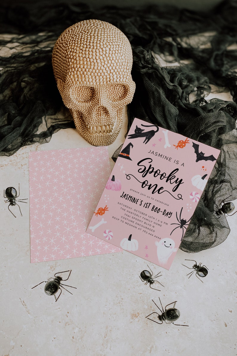 May include: A pink and black Halloween party invitation with a skull, bats, candy, and a ghost. The invitation reads "Jasmine is a Spooky One" and "Jasmine's 1st Boo-Day".