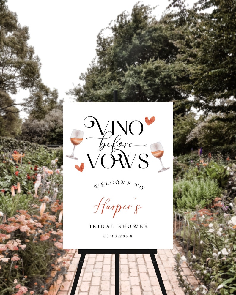 Pode incluir: Um cartaz branco com o texto "Vino before vows" em escrita cursiva com um cora&ccedil;&atilde;o vermelho e duas ta&ccedil;as de vinho com cora&ccedil;&otilde;es vermelhos. O texto "Welcome to Harper's Bridal Shower 08.10.20XX" est&aacute; abaixo do texto principal.