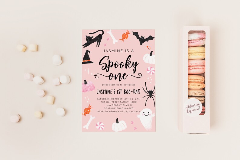 May include: Pink Halloween party invitation with black and white illustrations of a witch's hat, a black cat, a spider, a ghost, candy, pumpkins, and bones. The text reads "Jasmine is a Spooky One" and "Jasmine's 1st Boo-Day".