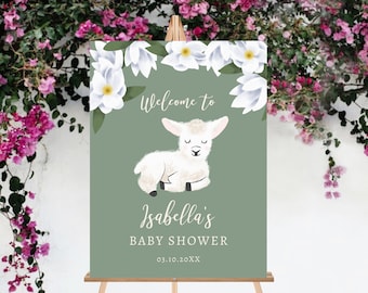 May include: A green welcome sign with white flowers and a white lamb. The sign says "Welcome to Isabella's Baby Shower 03.10.20XX".