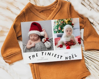 May include: A holiday card with two baby photos, one with a baby in a Santa hat and the other with a baby in a white hat. The card reads "THE TINIEST NOËL" and is placed on an orange onesie.