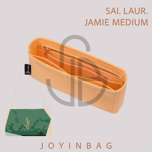 May include: A light orange felt handbag organizer insert with multiple interior pockets and a zippered compartment. The text SAI. LAUR. JAMIE MEDIUM is printed in the upper right corner, and the text JOYINBAG is printed at the bottom center.
