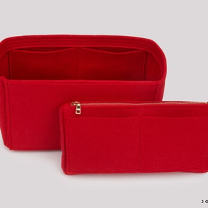 May include: Red felt bag organiser with multiple compartments and a zipped pouch. The organiser is designed to fit inside a larger bag, keeping items organised and easy to find.