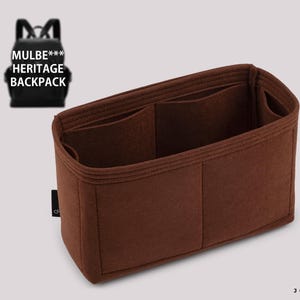 May include: Brown felt bag organizer with multiple compartments. The organizer has a brown felt lining and is designed to fit inside a larger bag.